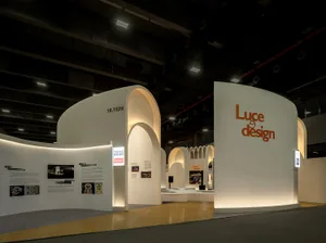A minimalist exhibition space with white walls and a modern design.