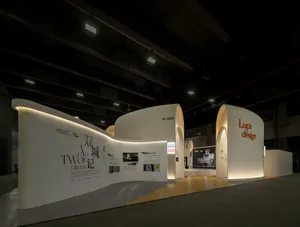 A minimalistic exhibition space featuring illuminated white panels.