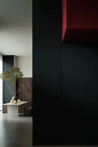 Modern living space with black and red accents