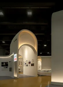 An interior space with curved white walls and modern design elements.
