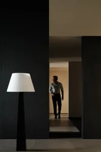 A minimalist lamp in a contemporary indoor setting.