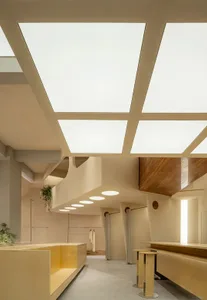 Modern retail storefront with glass windows and wooden elements, featuring a sleek and contemporary design.