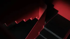 Black wooden staircase with red accents