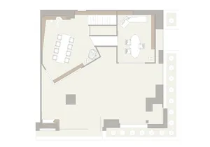 A floor plan of an office layout with desks, chairs, and conference areas.