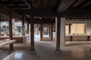 A modern retail store with concrete columns, showcasing contemporary design elements.