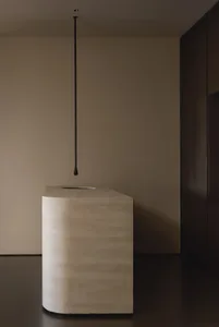 A minimalist concrete bathroom with a modern, sleek design.