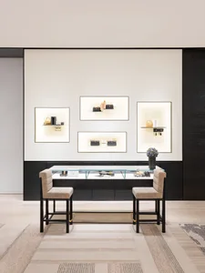 A modern retail display featuring a glass counter with various items on display, set against a polished concrete wall and sup