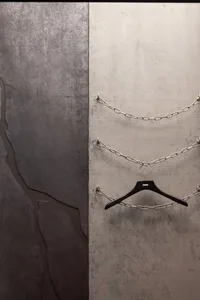 An industrial-style art installation featuring metal chains