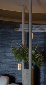 Concrete columns and greenery in a modern lobby setting