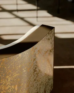 A modern interior design featuring gold-leaf detailing
