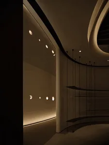 A modern architectural space with wheelchair accessibility designed using concrete materials.