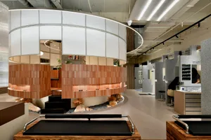 Modern retail store featuring minimalist design with brick and glass elements.