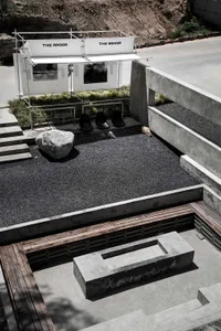 An exhibition space with modern design elements featuring concrete materials.