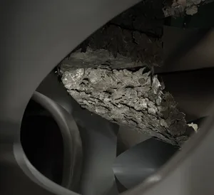 A photograph of an industrial staircase made of metallic material.