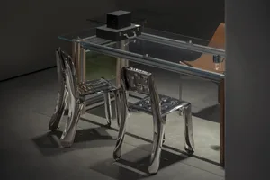 A sleek, modern interior featuring metal furniture with a futuristic design.