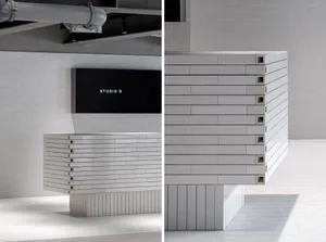 A minimalist interior space made entirely of concrete blocks.
