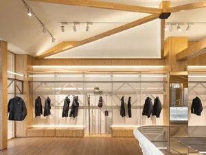 Modern retail store interior featuring wooden cabinets and sleek design elements.