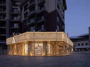 Modern retail storefront with glass facade and illuminated interior.