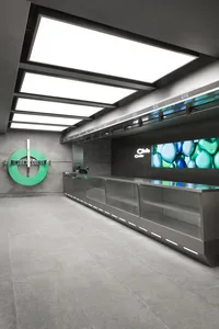 Modern retail storefront with glass counters and digital display.