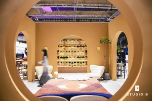 Modern retail store with a contemporary interior design featuring arches, sleek furniture, and an array of modern lamps.