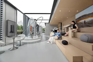 Interior of a modern coffee shop with glass walls, wooden seating, and concrete finishes.