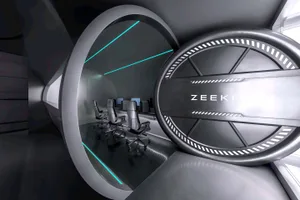 A futuristic office space with modern furniture and glass walls.