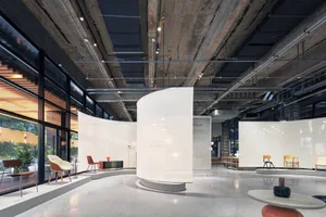 Industrial exhibition space featuring modern glass walls