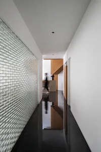 A modern interior design space featuring a glass wall.