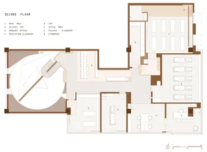 Floor plan of an open-concept office space on the second floor, featuring large windows and an open layout.