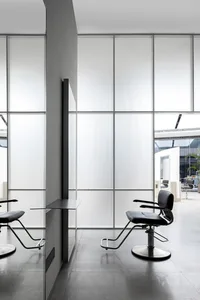 Industrial-style spa interior featuring a frosted-glass window