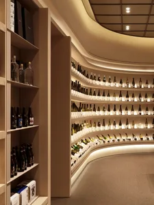 A modern interior design of a wine shop featuring wooden shelves and lighting.