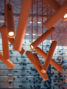 Close-up of modern industrial lighting fixtures in a contemporary setting.