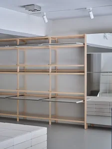 Minimalist design interior featuring wooden shelves and glass elements