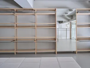 Modern warehouse showroom interior with wooden shelves and metal accents