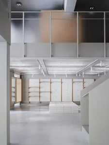 A modern retail store with concrete walls and minimalist design.