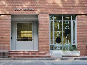 Modern retail storefront featuring brick cladding exterior.