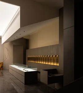 Modern retail storefront featuring glass and concrete materials.