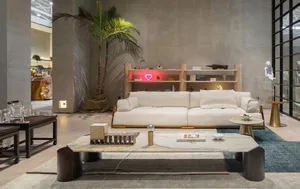 A minimalist living room featuring a white sofa, marble coffee table, and a palm tree with a red neon light in the background