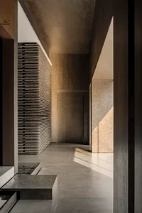 Concrete entrance with modern design, featuring clean lines and minimalist aesthetic.