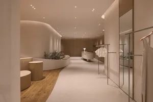 A modern retail storefront with natural materials such as wood and stone.