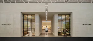 Modern retail storefront featuring large glass windows