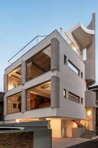 Modernist building exterior featuring concrete and glass materials