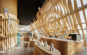 A minimalist cafe bar with wooden decor and contemporary design elements.