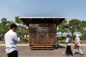 A minimalist modern office space with wooden and glass elements.