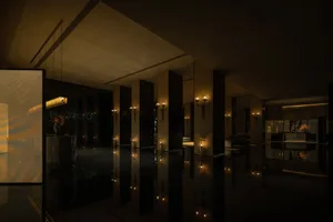Modern hotel lobby featuring metallic accents and contemporary design elements.