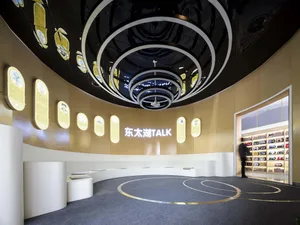 A modern installation featuring circular lighting patterns in a contemporary interior setting.