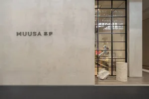 Modern storefront with concrete interior and exterior design.