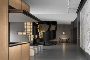 Contemporary lobby with black and white marble and metal accents, designed by ABC Architects.