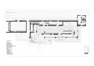 A detailed architectural floor plan of a showroom with a concrete and glass design.