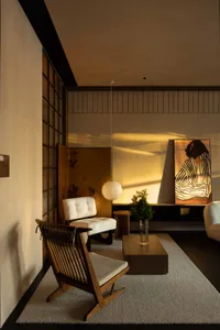 A modern living room with white furniture and wooden accents.